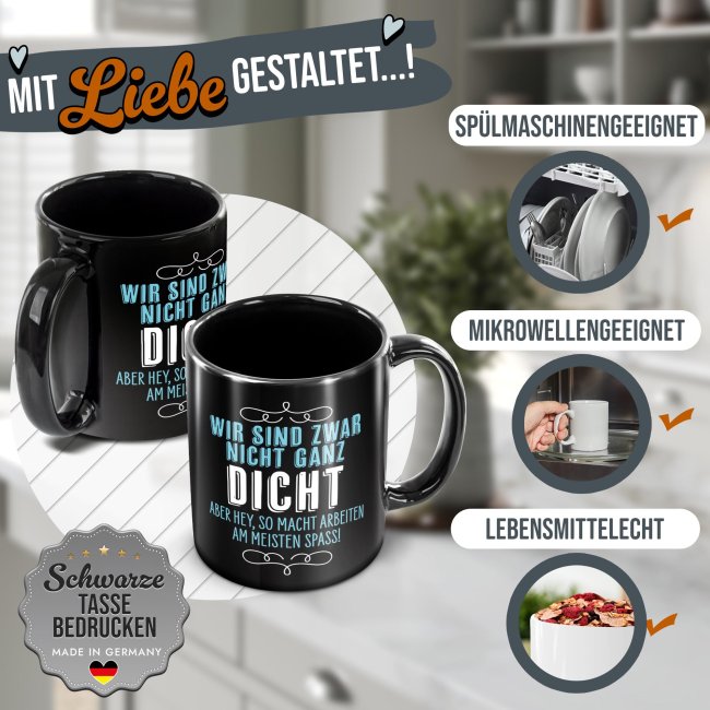 Schwarze Tasse mit Spruch - Wir sind nicht ganz dicht